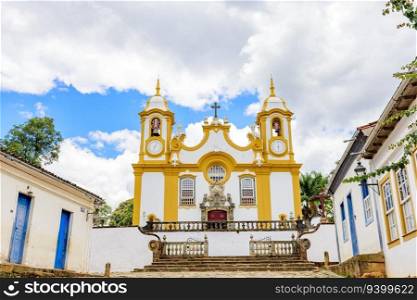 Houses and historic church in an old cobbled street in the famous city of Tiradentes in Minas Gerais. Houses and historic church in an old cobbled street