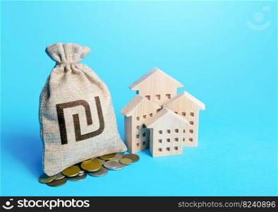 Houses and israeli shekel money bag. Increasing property value. Fair market price. Home taxation. Residential or commercial property income. Municipal budget. Real estate investment, rental business.