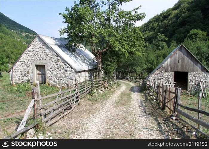 Houses and wooden fence in village Stabna, Montenegro