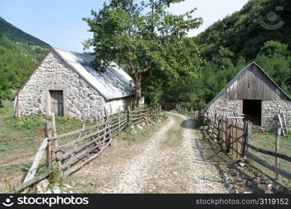 Houses and wooden fence in village Stabna, Montenegro