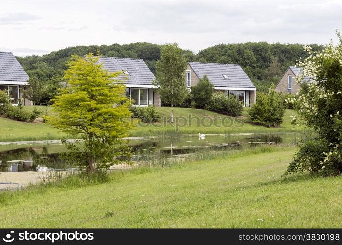 houses for holiday in nature with small lake in holland