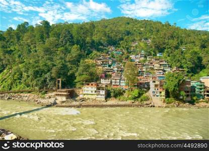 Houses in a town on river. India, Sikkim, Gangtok