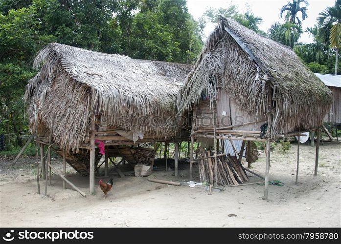 Houses in village Orang Asli - the aborigines of Malaysia on in Berdut, Malaysia. More than 76% of all Orang Asli live below the poverty line.
