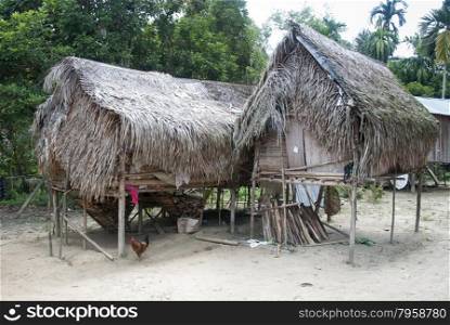 Houses in village Orang Asli - the aborigines of Malaysia on in Berdut, Malaysia. More than 76% of all Orang Asli live below the poverty line.