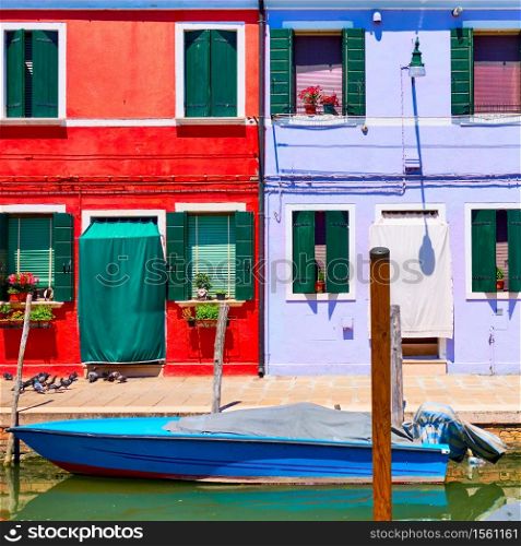 Houses of vivid colors by canal in Burano in Venice, Italy. Italian cityscape