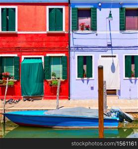Houses of vivid colors by canal in Burano in Venice, Italy. Italian cityscape