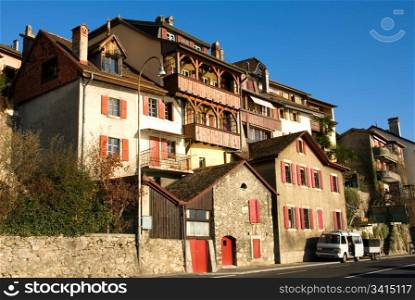 Houses on a steep hilside, adjacent to the shoreline of Lake Geneva, Switzerland