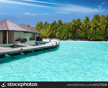 houses on piles on sea. Maldives