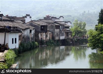 Houses on the riverbank in Shexian town, China