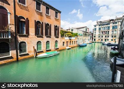 Houses peeling off from dampness. Venice is situated across a group of islands that are separated by canals and linked by bridges. Gondola is a traditional, flat-bottomed Venetian rowing boat