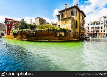 Houses peeling off from dampness. Venice is situated across a group of islands that are separated by canals and linked by bridges. Gondola is a traditional, flat-bottomed Venetian rowing boat