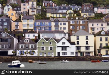 Houses stacked up the hillside at Dartmouth, Devon, England.