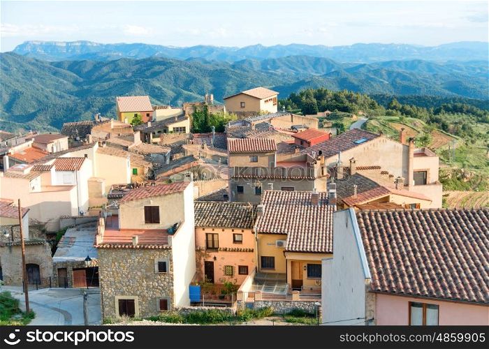 Houses with red roof tiles in a small european town, Spain