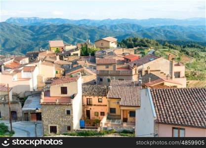Houses with red roof tiles in a small european town, Spain