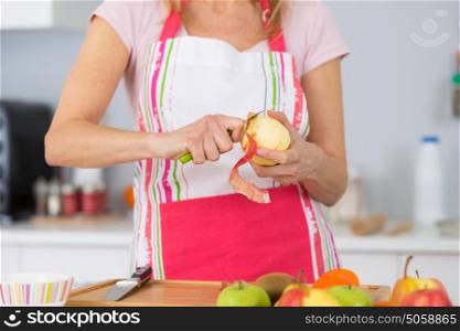 housewife cutting apple