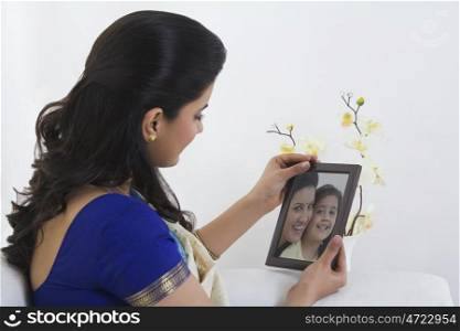 Housewife looking at a photograph