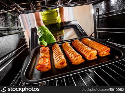 Housewife preparing cakes in the oven at home, view from the inside of the oven. Cooking in the oven.