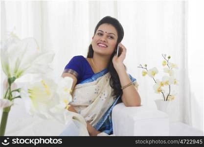 Housewife talking on a mobile phone