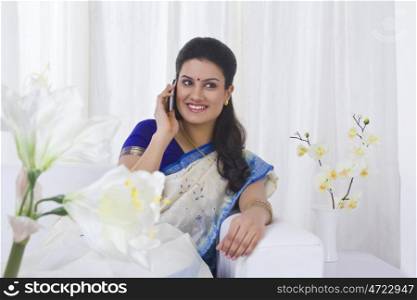 Housewife talking on a mobile phone