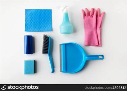 housework, housekeeping and household concept - cleaning stuff on white background