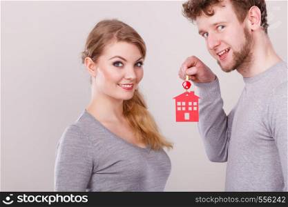 Housing security family love romance furute planning finances concept. Couple with house keys. Man with lady holding home pendant keyring.. Couple with house keys.
