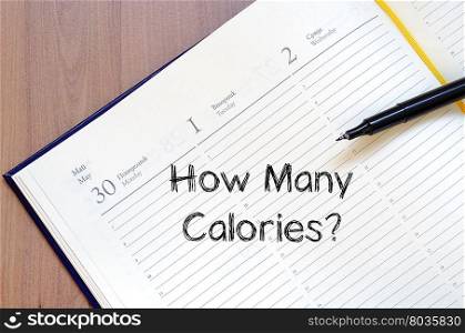 How many calories text concept write on notebook
