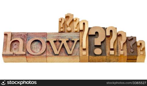 how question - isolated vintage wood letterpress printing blocks with multiple question marks