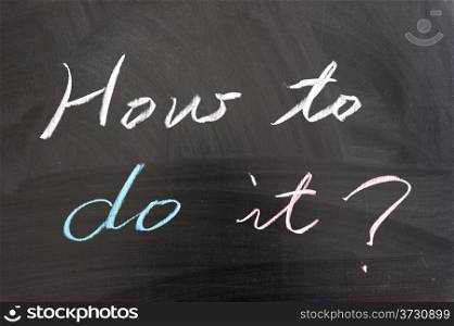""How to do it?" sentence written on the chalkboard"
