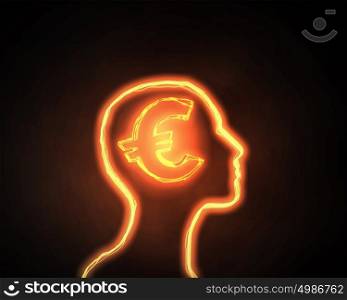 How to earn money. Human head and brain with euro sign on dark background