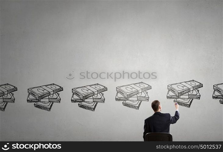 How to increase your income. Rear view of businessman drawing with marker money earning concept