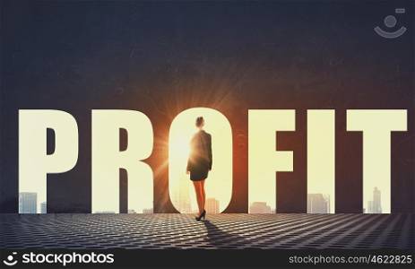 How to increase your profit. Back view of businesswoman standing in light of profit concept