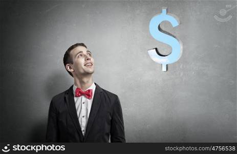 How to make your income grow. Portrait of young man looking above his head on dollar sign