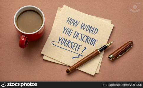 How would you describe yourself? Handwriting on a napkin with a cup of coffee. Identity and personality concept