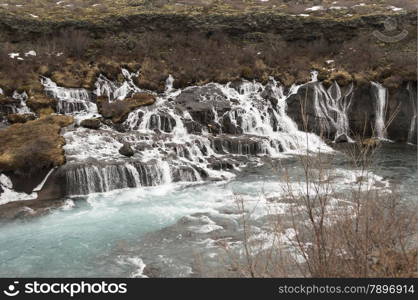 Hraunfossar waterfall with blue water on iceland