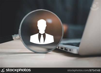 HRM impact Magnifier glass highlights manager icon on circle wooden, signifying its influence on human resource development, recruitment, and leadership success. employees selection