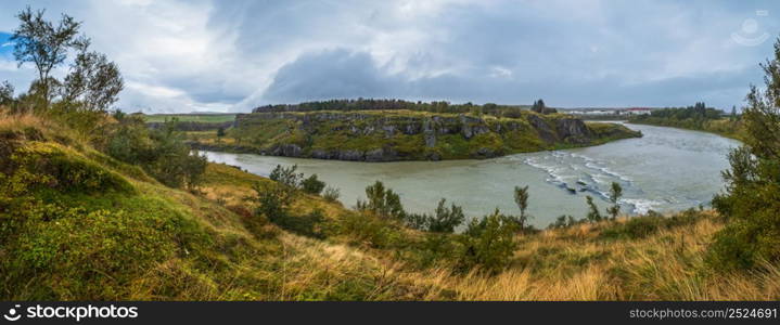 Hrutey island public park near Blonduos town, North-West of Iceland. View during auto trip by Ring Road. Spectacular Icelandic landscape with scenic autumn nature and Blanda river with cataracts.