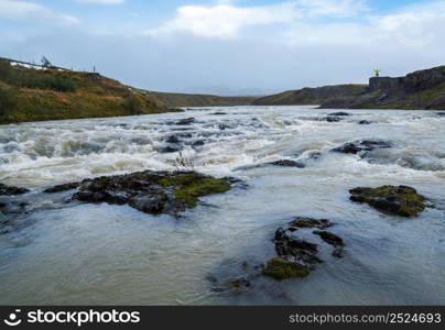 Hrutey island public park near Blonduos town, North-West of Iceland. Spectacular Icelandic landscape with scenic autumn nature and Blanda river with cataracts. Man unrecognizable.