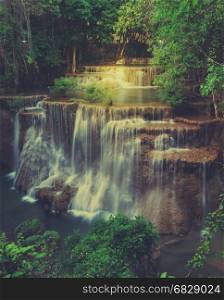 Huay Mae Khamin Waterfall, Paradise waterfall in Tropical rain forest of Thailand. Vintage filtered effect image
