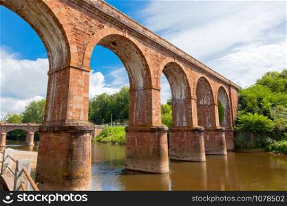 Huge arch train bridge built over Sorgue river in France
