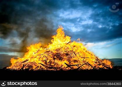 huge bonfire burning at sunset