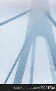 Huge bridge construction on metal strains in foggy weather, giving a mysterious city feeling. Poster or book cover concept