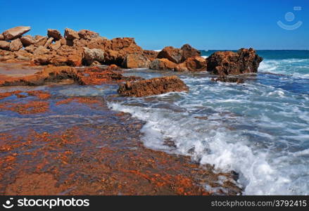 Huge rocks on the coast of the storm sea