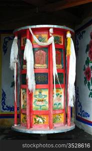 Huge Tibetan prayer wheel in a lamasery
