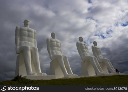 Huge white statues of men in Denmark