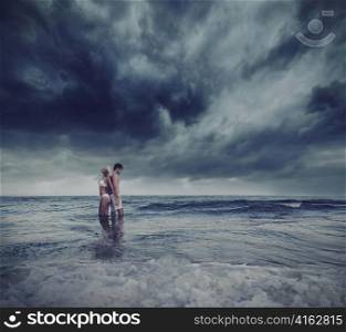 Hugging lovers in the sea