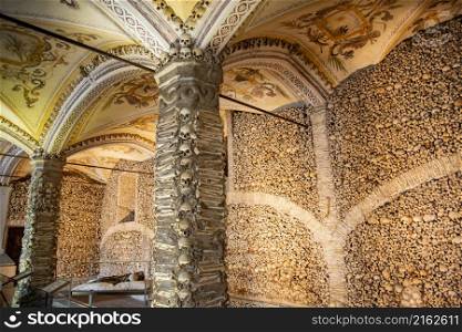 Human Bones at the Capela dos Ossos at the St Francis Church or igreja de Sao Francisco in the old Town of the city Evora in Alentejo in Portugal. Portugal, Evora, October, 2021