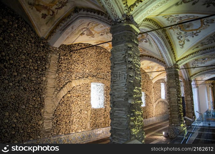 Human Bones at the Capela dos Ossos at the St Francis Church or igreja de Sao Francisco in the old Town of the city Evora in Alentejo in Portugal. Portugal, Evora, October, 2021