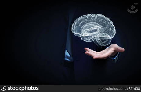 Human brain. Close up of businessman hand holding brain in palm