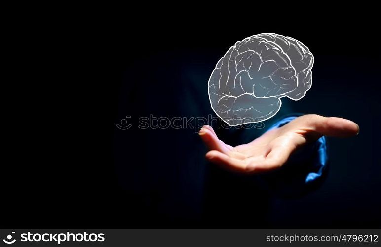 Human brain. Close up of businessman hand holding brain in palm