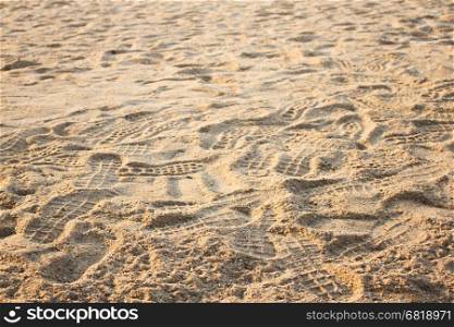 human footprints in the sand on the beach